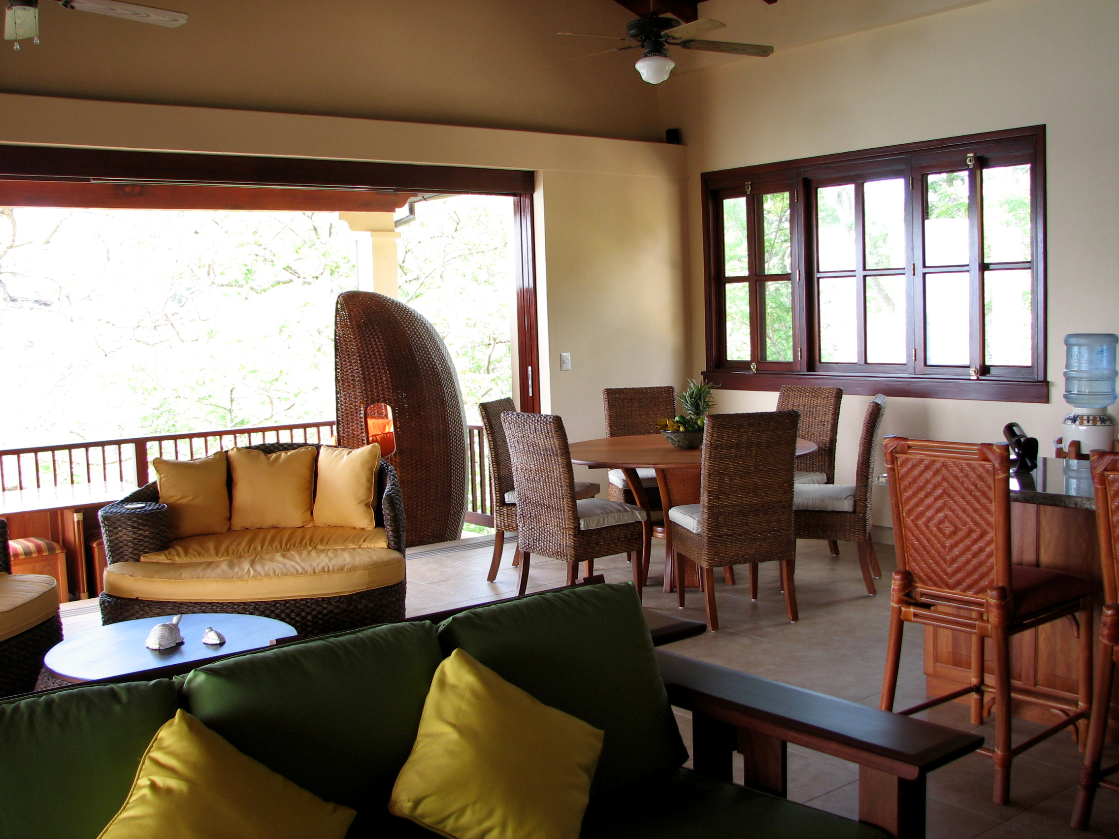 Cala Azul Honeymoon Villa entertainment looking towards the dining table and open door to upper balcony