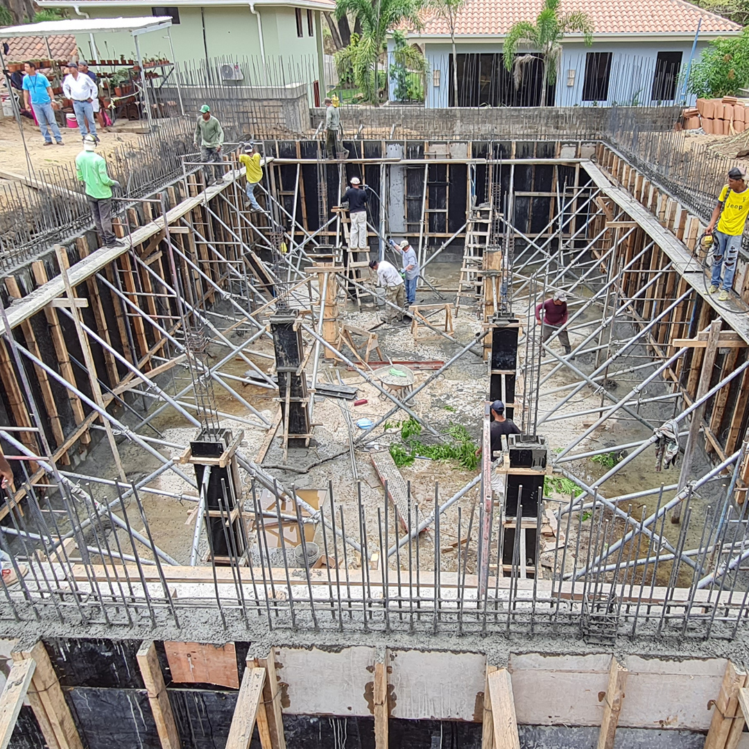 Rainwater Cistern construction with rebar and workers